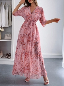Detail of elegant pink floral long dress with lightweight fabric and professional finish