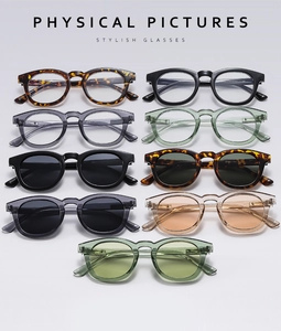 Vertical array of small round sunglasses in leopard print, black, and transparent frames