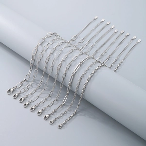 Set of 10 assorted silver stainless steel anklets featuring lobster clasps and extenders