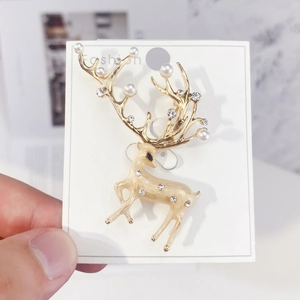 Elegant Christmas reindeer brooch with white pearls and sparkling zircons in gold finish