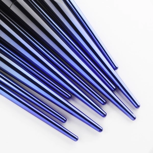 Close-up of electric blue metallic tapered handles on professional makeup brushes