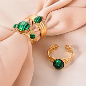 Vintage gold titanium steel ring featuring green malachite stones and an open design