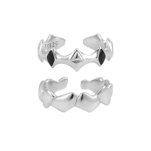Irregular geometric S925 sterling silver ring with black enamel and wavy heart patterns