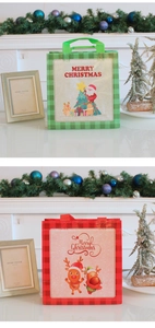 Detailed view of red and green festive non-woven Christmas gift bags with reindeer and Santa