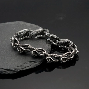 Punk style stainless steel cobra gesture bracelet with antique silver finish texture