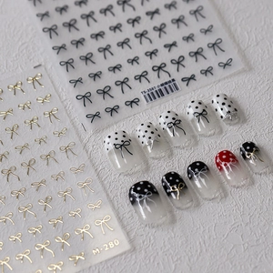 Minimalist black bow nail art stickers TS3587 and gold decals on white background