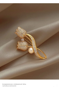 Detailed view of luxury tulip brooch with pavé zircon petals and a round pearl accent