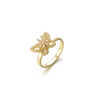 Detailed macro view of a gold butterfly ring featuring white zircon paved wing edges