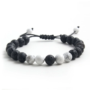 Macro detail of natural tiger eye and lava stone beads with adjustable woven cord