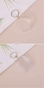 Close-up of clear acrylic photo keychains in round and rectangular shapes with metal rings