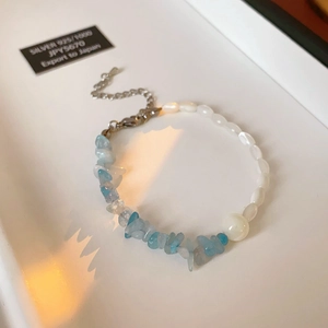 Close-up of aquamarine gravel and pearl stitching bracelet with 925 silver lobster clasp