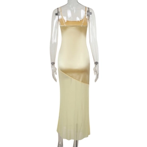 Detail view of the elegant satin back and mesh stitching on this light yellow maxi dress