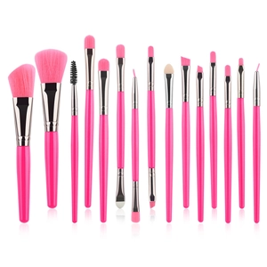 Detailed arrangement of 15 pieces professional pink makeup brush set on white background