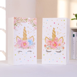 Two cute unicorn paper gift bags with floral patterns and gold accents for party favors
