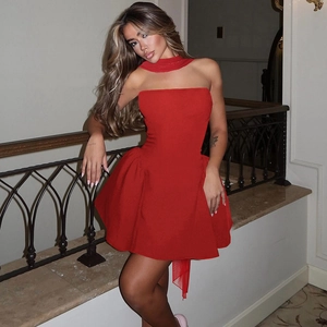 Detail of red strapless puff mini dress featuring halter neck and separate tie design