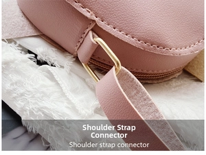 Detail of pink faux leather texture and golden metal shoulder strap connector for kids bag