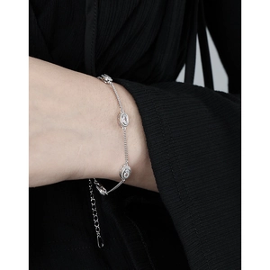 Elegant S925 sterling silver bracelet featuring oval rhinestones on woman's wrist