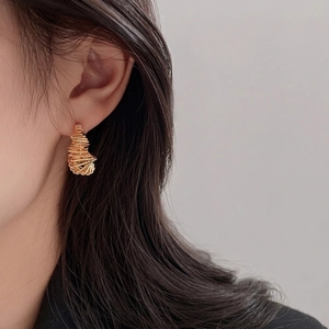 Chic gold-plated twisted wire hoop earrings for women with minimalist metallic design