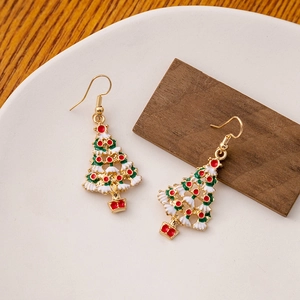 Detailed view of festive gold-tone Christmas tree earrings with colorful enamel decor