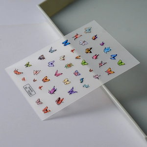 Macro view of 5D embossed butterfly nail stickers with colorful textures and patterns