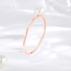 Elegant close-up view of a 1mm rose gold faceted geometric thin ring for women stackable style