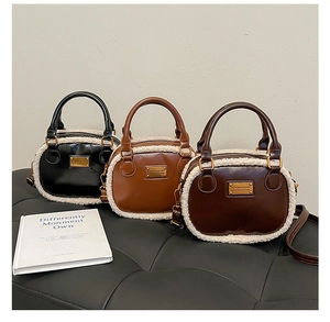 Plush-trimmed mini Boston bags in black, caramel, and dark brown leather variants