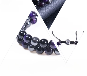 Detail view of 8mm purple tiger eye and obsidian beads with double-layer woven cord