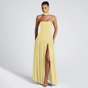 Elegant strapless light yellow dress with side slit and flowing ribbon details