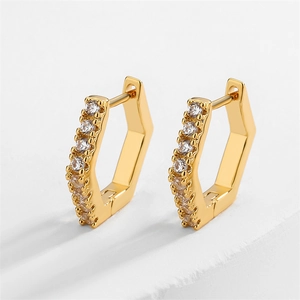 Macro view of gold geometric hexagonal earrings with micro-set clear zircon crystals