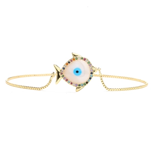 Detailed close-up of adjustable gold 18K plated fish evil eye bracelet with colorful zircons