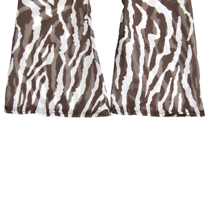 Detailed macro view of zebra print flare pants hem in lightweight brown mesh fabric