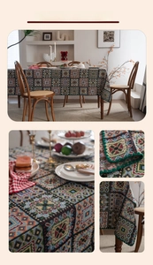Detail of vintage French jacquard tablecloth with geometric embroidery and green shell lace