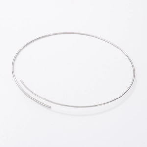 Minimalist silver stainless steel choker necklace with a sleek polished finish on white