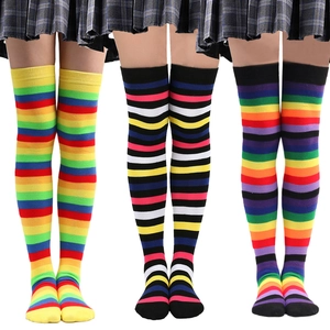 Three pairs of colorful rainbow striped thigh high socks for cosplay and party wear