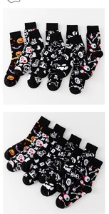 Detail of Halloween socks set featuring pumpkin, ghost, and bat knit patterns