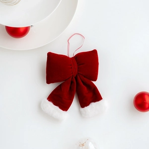 Red velvet Christmas bow with white faux fur trim and silk hanging loop for tree decor