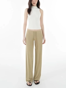 Summer casual outfit featuring a white high neck sleeveless top and khaki wide-leg drawstring pants