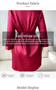 Detail of wine red imitation silk sleepwear showing smooth satin texture and fabric care icons