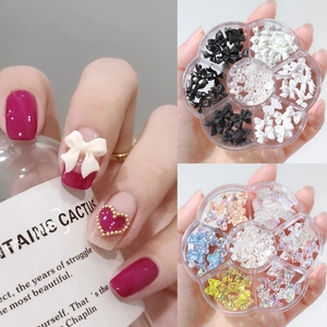 Mixed nail art charms kit with 3D bows, aurora bears, and pearls in a floral organizer box
