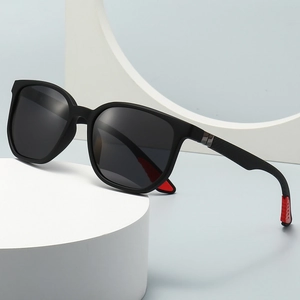 Fashion geometric sunglasses with black frames, grey lenses, and red details for adults