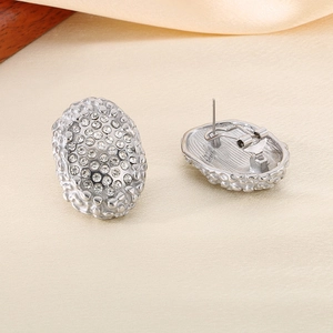 Oval silver stainless steel earrings with sparkling pavé crystals and honeycomb texture