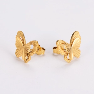 Detailed view of gold butterfly earrings with textured solid and hollow wing designs