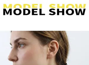 Close-up of a minimalist black metal hair clip worn by a model for a sleek hairstyle