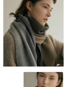 Detailed view of bicolor knitted scarf featuring grey houndstooth pattern and beige lining