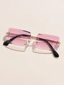 Detailed top view of rimless square sunglasses with pink gradient lenses and gold temples