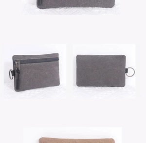 Close-up of durable canvas coin purse with zipper closure and metal D-ring buckle