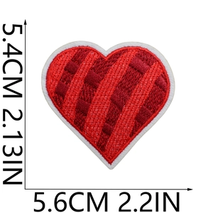 Detailed view of red embroidered heart patch with white borders measuring 5.4cm by 5.6cm