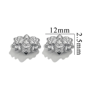 Macro shot of 12mm silver stainless steel flower spacer bead with carved floral pattern