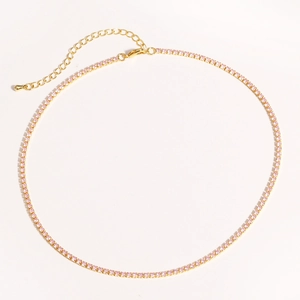 Detail of pink zircon tennis necklace with gold-plated chain and lobster clasp closure