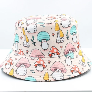 Detailed top-down view of a light beige bucket hat with colorful cartoon mushroom prints